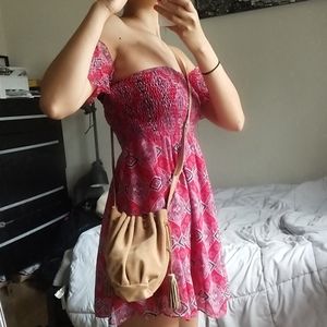 Suede drawstring bucket bag with tassels